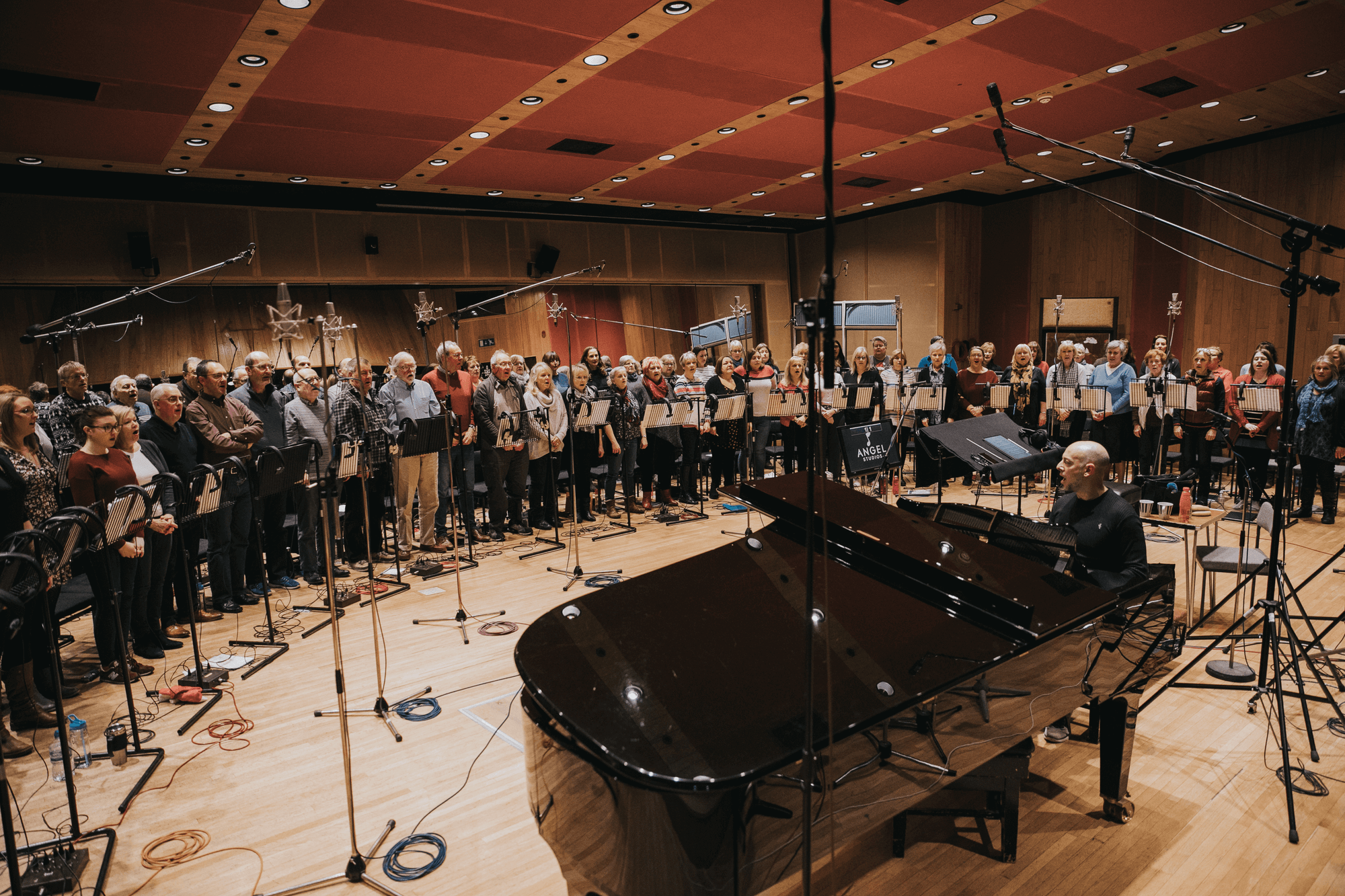 Next Stage Choir recording together in the studio