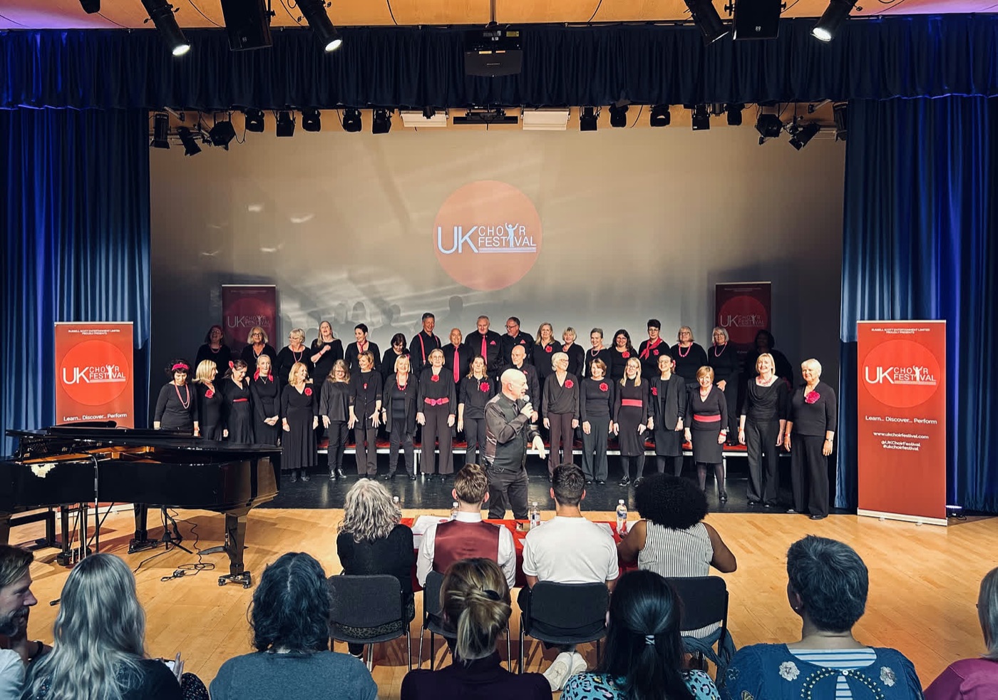 Russell Scott introducing Next Stage Choir at the UK Choir Festival